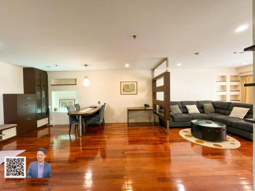 Spacious living room with dining area and modern furnishings