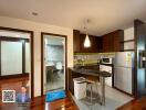 Modern kitchen with adjacent bathroom and living area