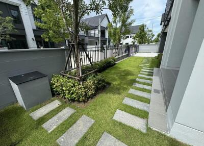 Well-maintained garden space with grass and stepping stones