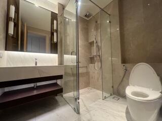 Modern bathroom with glass shower and sleek fixtures