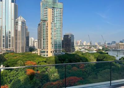 View from balcony showing cityscape and greenery