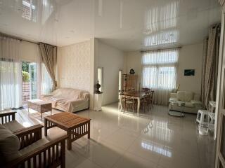 Spacious living room with elegant furniture and large windows