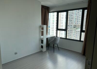 Bedroom with desk and large window