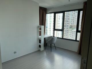 Bedroom with desk and large window