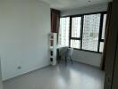 Bedroom with desk and large window