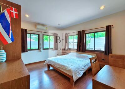 Spacious bedroom with large windows