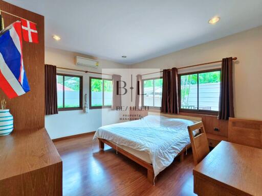 Spacious bedroom with large windows