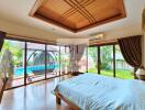 Spacious bedroom with pool view and ample natural light