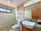 Modern bathroom with glass shower and large vanity mirror