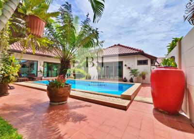 Beautiful backyard with a pool and lush greenery