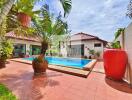 Beautiful backyard with a pool and lush greenery