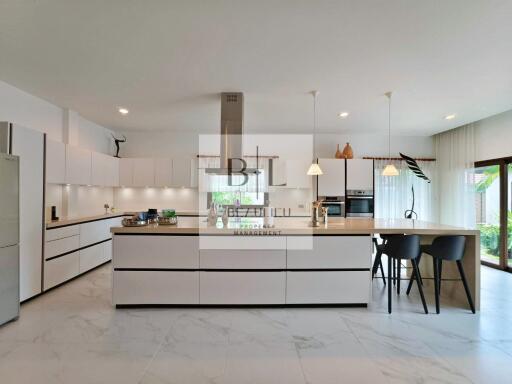 Modern kitchen with island and built-in appliances