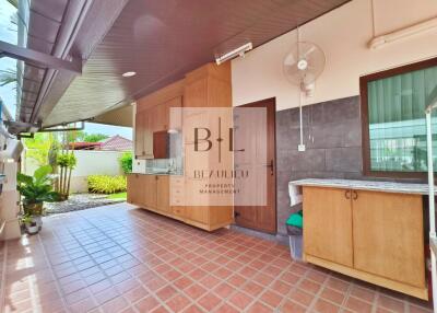 Outdoor kitchen area with tiled floor