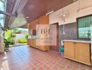 Outdoor kitchen area with tiled floor