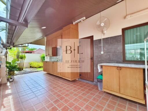 Outdoor kitchen area with tiled floor