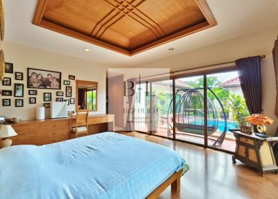 Spacious bedroom with pool view