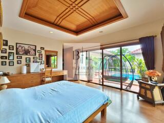 Spacious bedroom with pool view