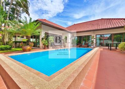 Outdoor view of a house with a swimming pool