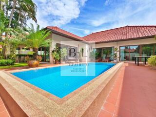 Outdoor view of a house with a swimming pool