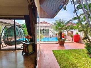 Outdoor patio with garden and pool view