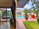 Outdoor patio with garden and pool view