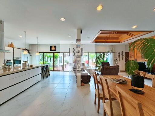 Spacious open-plan kitchen and living area with modern furnishings