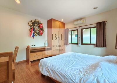 Bedroom with modern furniture and wooden floor