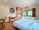 Bedroom with modern furniture and wooden floor