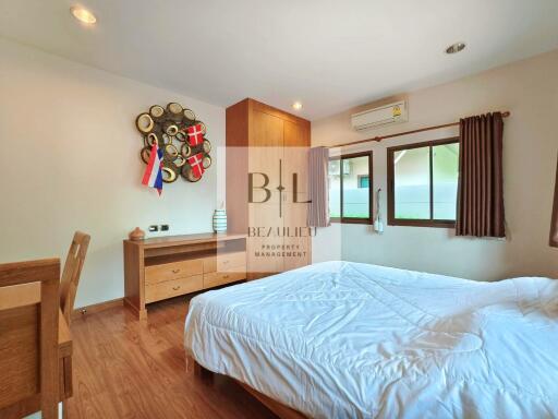 Bedroom with modern furniture and wooden floor