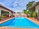 Outdoor swimming pool with deck and plants