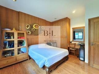 Cozy bedroom with wooden furniture and decor