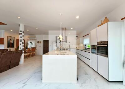 Modern kitchen with island and dining area