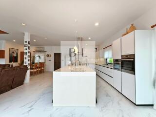 Modern kitchen with island and dining area