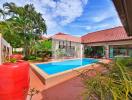 Spacious patio with swimming pool in a tropical garden