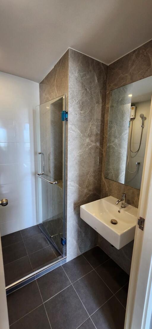 Modern bathroom with a walk-in shower and sink