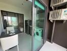 Modern kitchen with adjoining dining area and balcony view