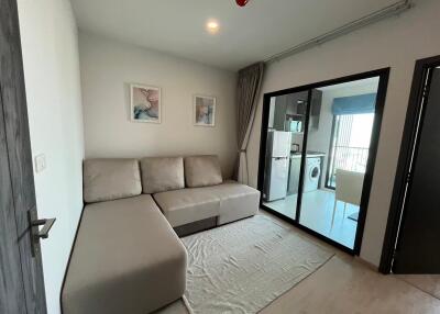 Modern living room with natural light and access to balcony