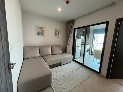 Modern living room with natural light and access to balcony