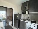 Modern kitchen with appliances and adjacent sitting area