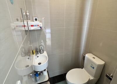 Modern bathroom with white fixtures and contemporary tiles