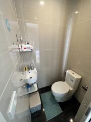 Modern bathroom with white fixtures and contemporary tiles