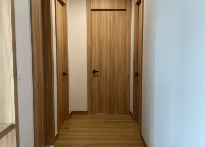 Wooden hallway with four doors