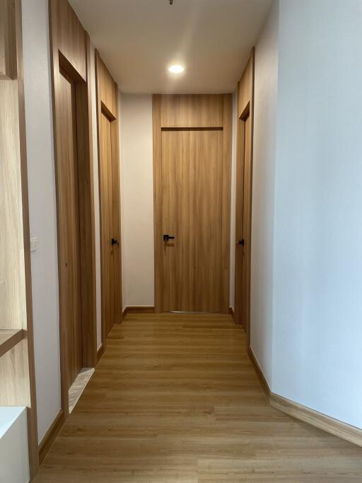 Wooden hallway with four doors