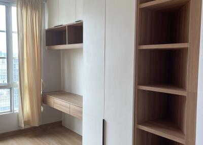 Modern bedroom with built-in storage and workspace