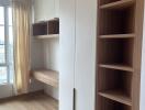 Modern bedroom with built-in storage and workspace