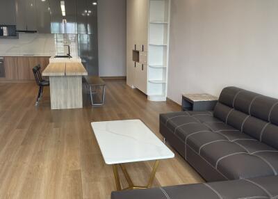 Modern open-plan living room and kitchen.