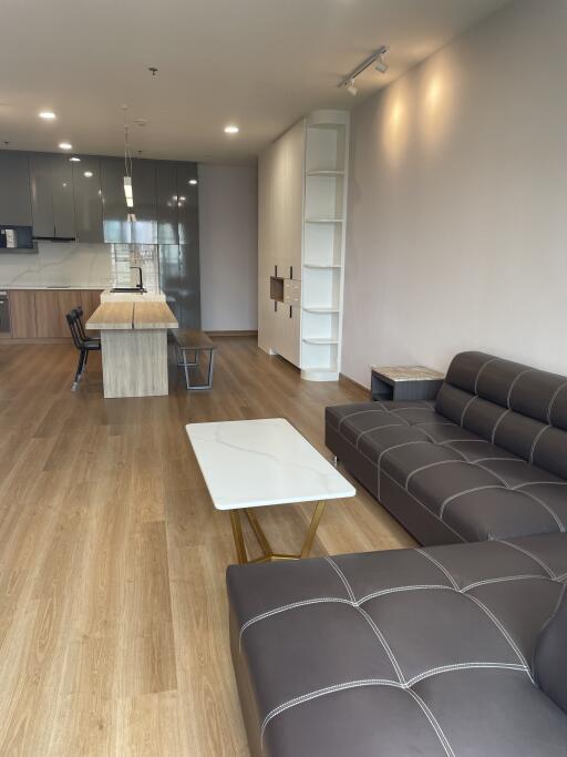 Modern open-plan living room and kitchen.