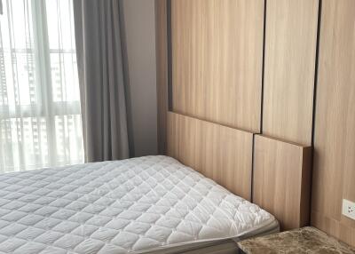 Bedroom with bed and built-in wooden wardrobe