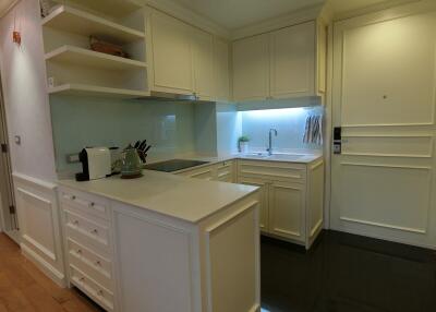 Modern kitchen with white cabinets and appliances