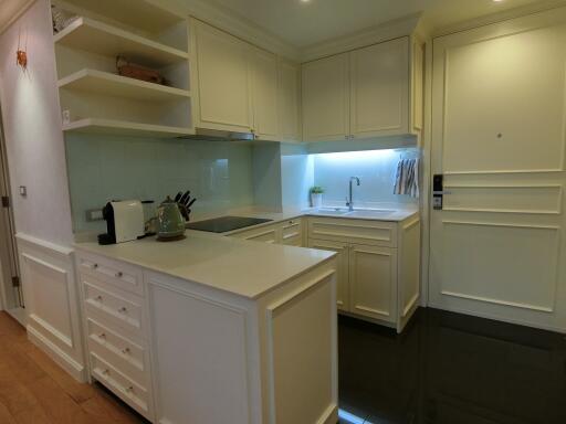 Modern kitchen with white cabinets and appliances